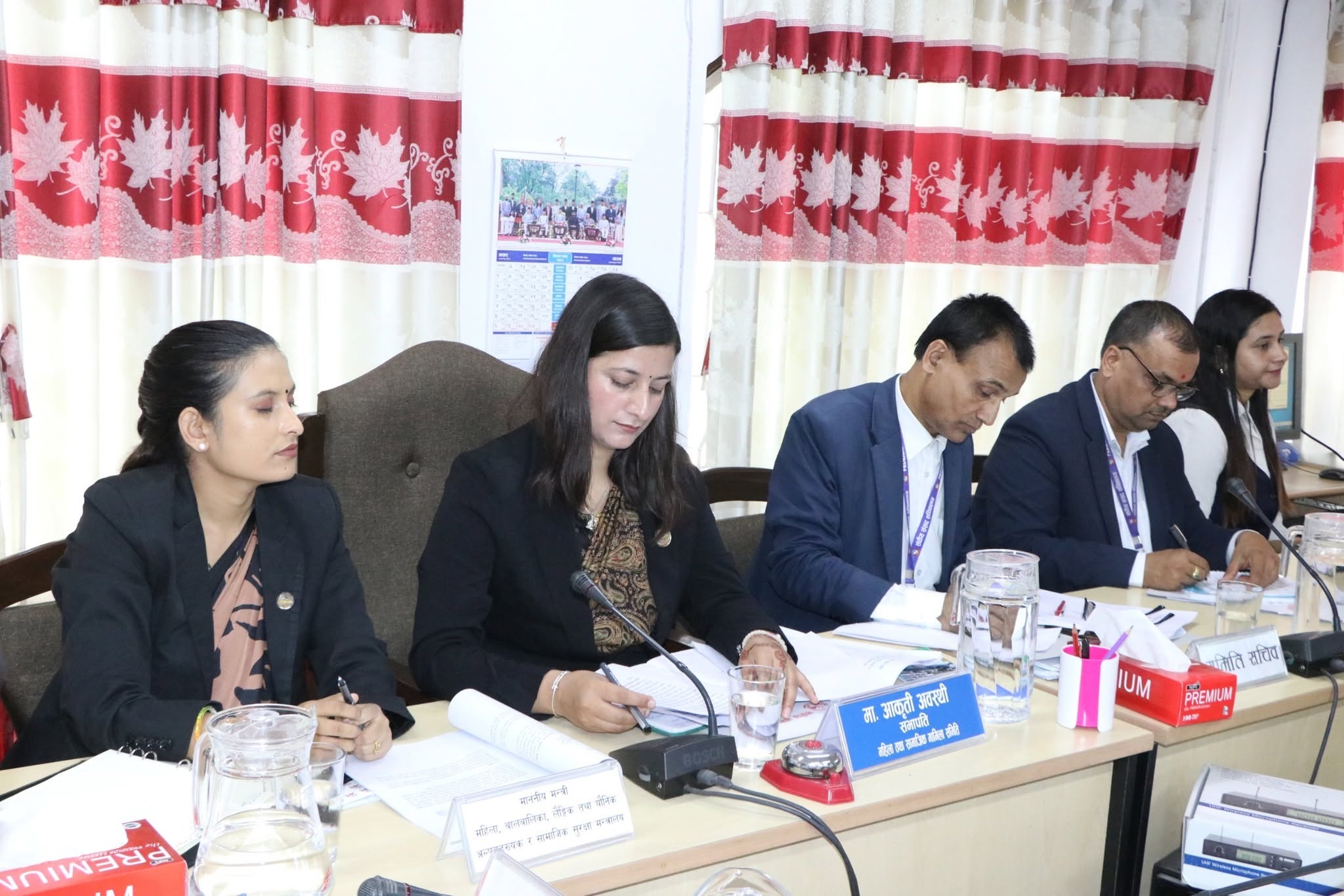 Committee members documenting key points during the meeting