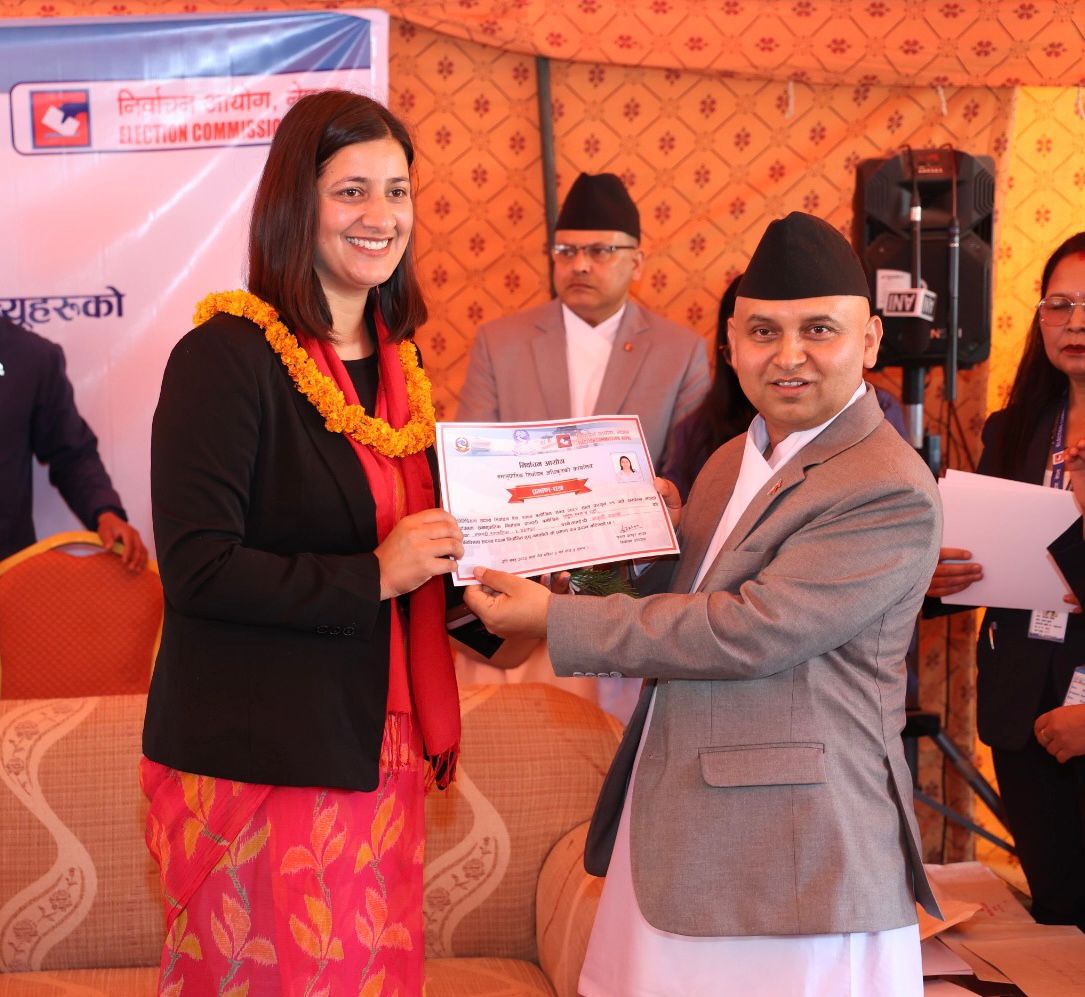 Aakriti Awasthi receiving an official certificate