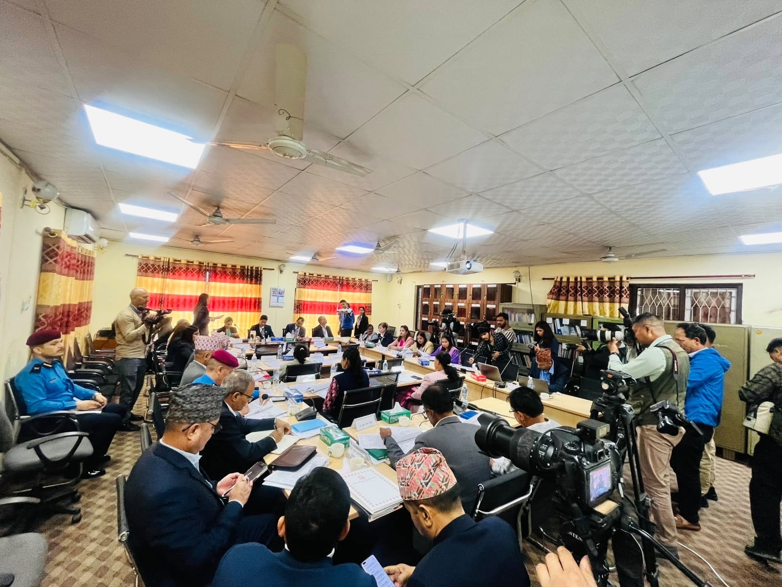 Members, invited officials, stakeholders, and media attending the meeting