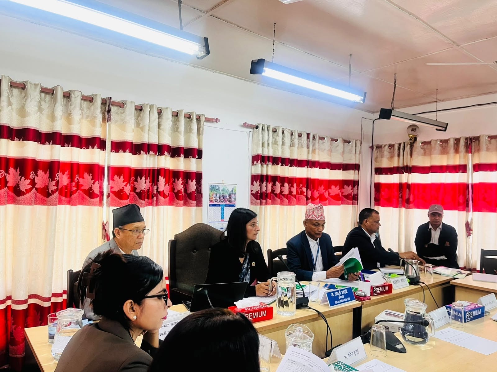 Officials and committee members participating in the meeting