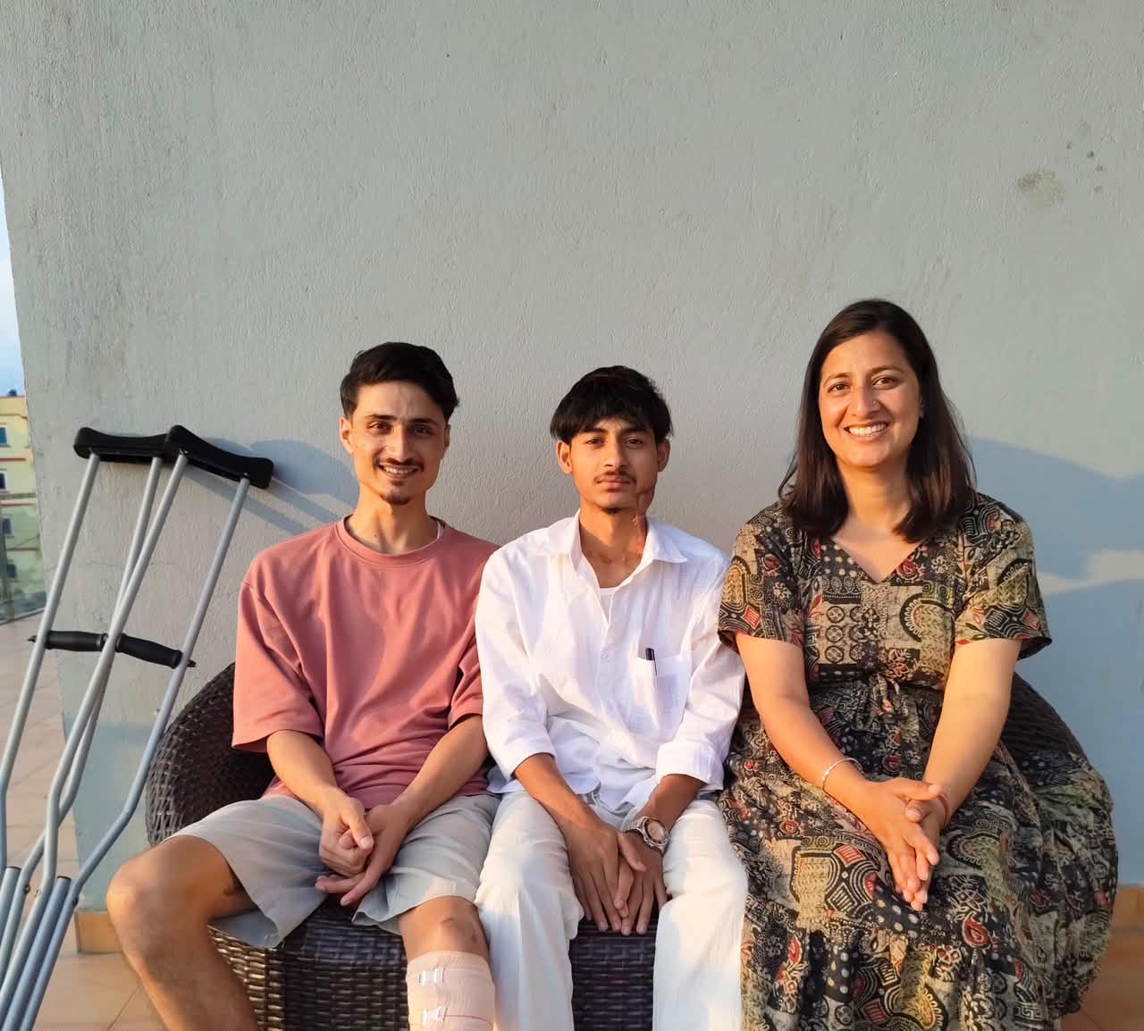 Aakriti Awasthi seated with two young men