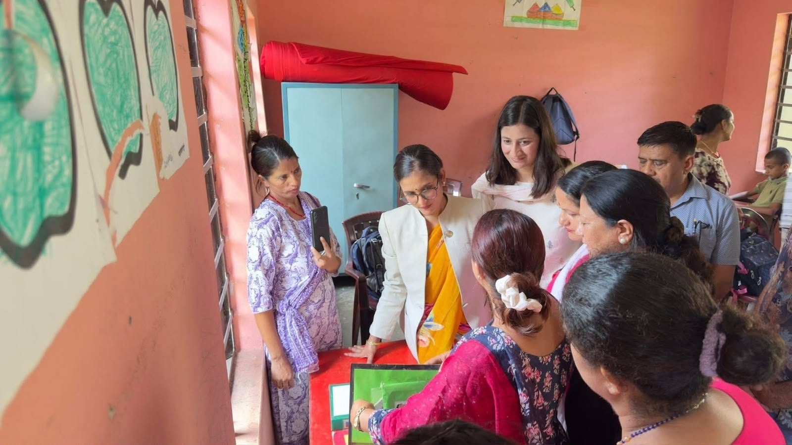 Committee members reviewing learning materials at Balmandir Autism School