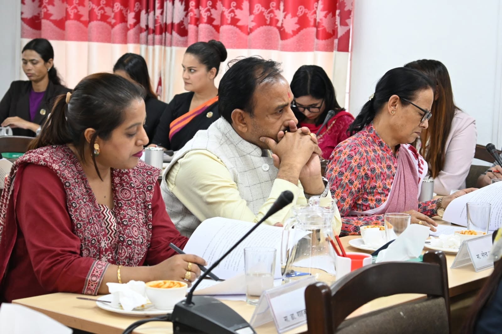 Subcommittee members reviewing meeting documents